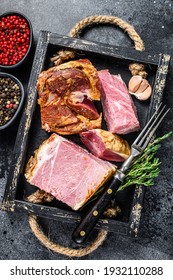 Smoked Sliced Pork Slab Bacon Meat In A Wooden Tray. Black Background. Top View.