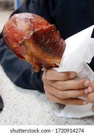 Smoked Turkey Leg On A Hand