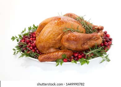 Smoked Turkey On A Tray Garnished With Fresh Cranberries And Herbs Over White Background. Thanksgiving Or Christmas Theme. (studio Isolated, Not PS)