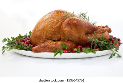 Smoked Turkey On A Tray Garnished With Fresh Cranberries And Herbs Over White Background. Thanksgiving Or Christmas Theme. (studio Isolated, Not PS)