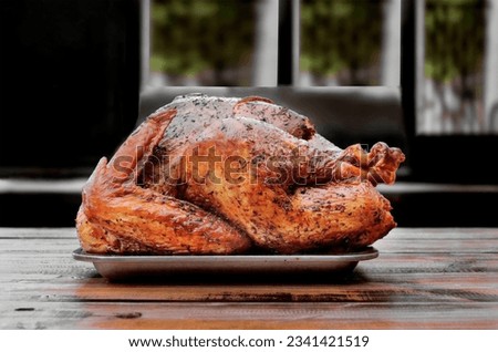 Smoked turkey prepared for thanksgiving. Isolated on a brown background. Close-up. Macro. American cuisine.