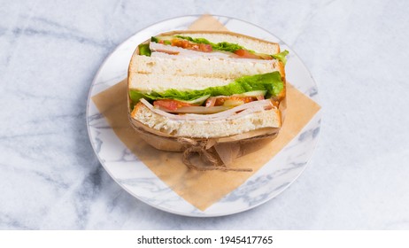 Smoked Turkey Sandwich In Paper.