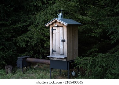 Smokehouse For Processing Meat. A Smoker Cabinet Made Of Wood.