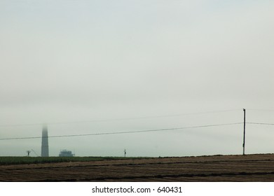 A smokestack from a utility plant