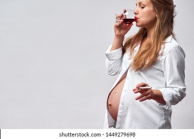 Smoking and alcohol pregnancy.woman on a long pregnancy drinking alcohol and Smoking cigarettes.problems of alcoholism and the period of bearing a child.danger of losing a baby, miscarriage. alcoholic