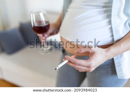 Smoking and alcohol pregnancy.woman on a long pregnancy drinking alcohol and Smoking cigarettes.problems of alcoholism and the period of bearing a child.danger of losing a baby, miscarriage. alcoholic