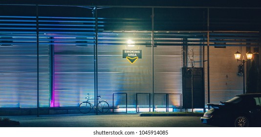 Smoking Area In Front Of A Bar Or Night Club In The Night