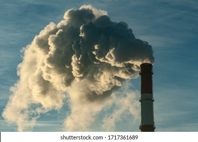 smoking chimney against the sky