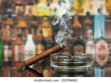 Smoking Cigar In An Ashtray