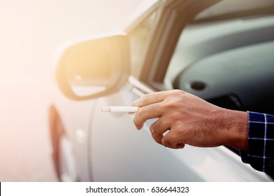 Smoking A Cigarette In Car.