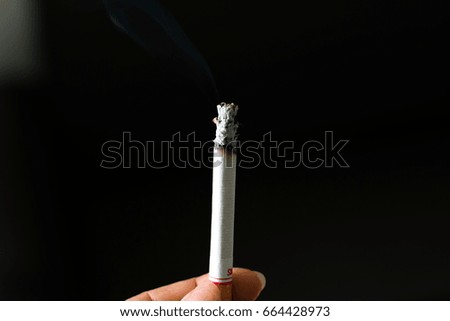 Similar – smoking time. Smoking Hand