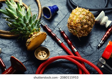 Smoking Hookah With Pineapple Flavored Tobacco. Modern Hookah For Smoking