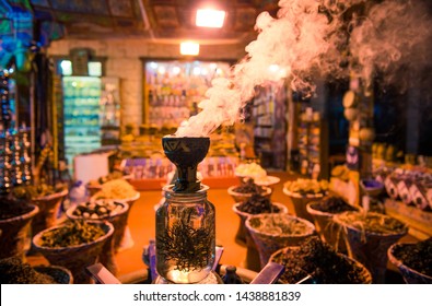 Smoking Incense At Night Market Shop Exterior