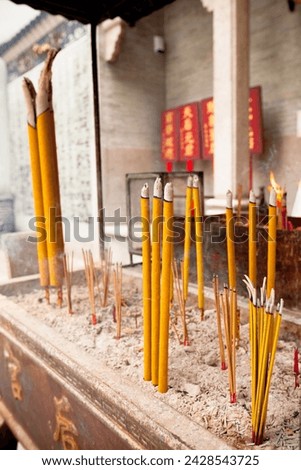 Smoking Incense Sticks at a Temple in Hong Kong