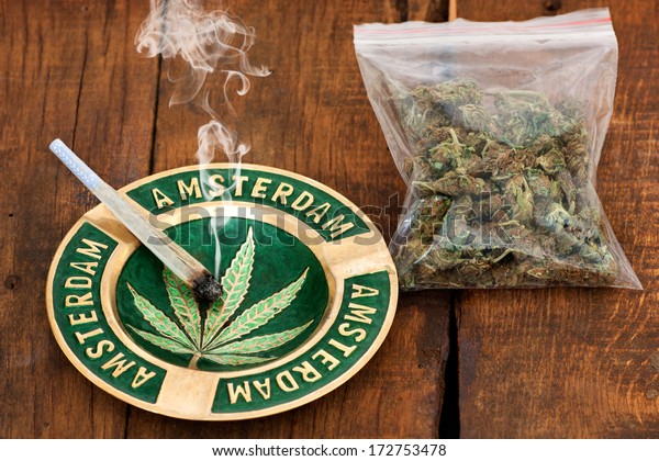 https://image.shutterstock.com/image-photo/smoking-marijuana-joint-ashtray-amsterdam-600w-172753478.jpg