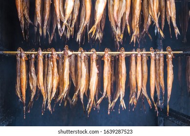 Smoking of smelt fishes (Hypomesus olidus) in Palanga, Lithuania