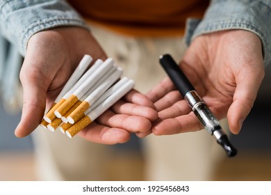 Smoking Tobacco E Cigarette. Holding Tobacco Vape