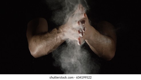 Smoky Chalk Dust Being Clapped Off Of Hands