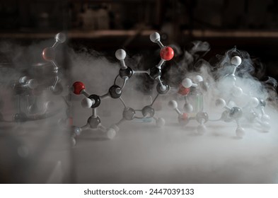 Smoky experiments with molecular model. Scientist working on chemical reaction, generating thick smoke. Copyspace - Powered by Shutterstock