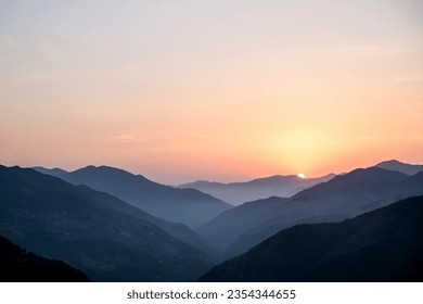 Smoky mountain sunset.Majestic autumn scenery of foggy valley at mountain range at early morning sunrise. Beautiful tonal perspective wide angle panorama - Powered by Shutterstock