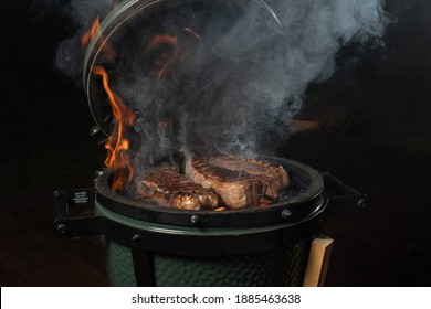 Smoky new york steak on egg type grill.