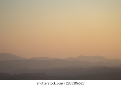 Smoky Sky And Hills At Sunset