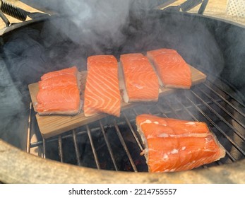 Smoky Smoked Salmon Smoking On Wood Cedar Plank On Grill