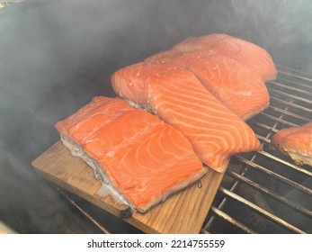 Smoky Smoked Salmon Smoking On Wood Cedar Plank On Grill