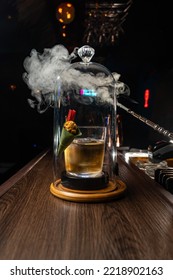 Smoky Whisky Cocktail With Popcorn Garnishing On Wooden Bar Top.