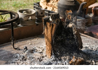 Smoldering Ashes Of A Bonfire. Ashes Ad Smoke
