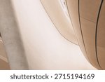 Smooth architectural forms creating an abstract pattern with concrete curves and a column, emphasizing modern design and minimalism
