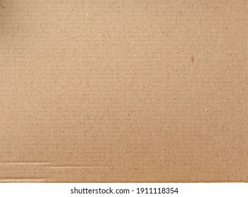 smooth brown cardboard paper, full frame, close up