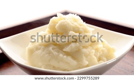 Smooth and Creamy: Top-View Close-up of Mashed Potatoes Served in a Plate