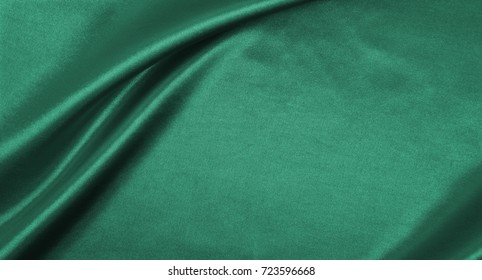 Smooth Elegant Green Silk Or Satin Luxury Cloth Texture Can Use As Abstract Background. Luxurious Background Design