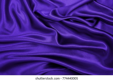 Smooth elegant lilac silk or satin luxury cloth texture can use as abstract background. Luxurious background design