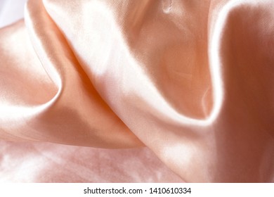 Smooth elegant pink beige golden silk wedding background. satin fabric In Sepia toned. Retro style