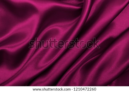 Smooth elegant pink silk or satin luxury cloth texture can use as abstract background. Luxurious valentines day background design