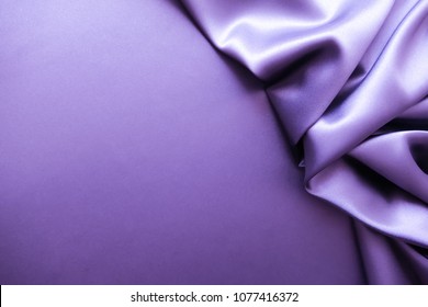 Smooth elegant violet purple satin silk luxury cloth fabric texture, abstract background design. Copy space
