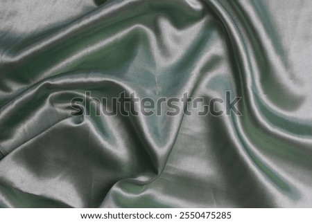Smooth elegant wavy deep black silk cloth fabric material texture. Background for banner, backdrop or texture for 3D mapping. Satin luxury cloth texture can use as abstract background