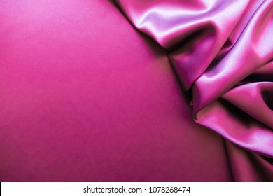 Smooth Elegant Wavy Hot Magenta Pink Satin Silk Luxury Cloth Fabric Texture, Abstract Background Design.