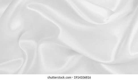 Smooth Elegant White Silk Or Satin Luxury Cloth Texture Can Use As Wedding Background. Luxurious Background Design