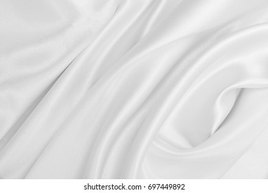 Smooth elegant white silk or satin luxury cloth texture can use as wedding background. Luxurious background design - Shutterstock ID 697449892