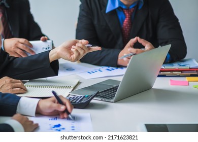 Smooth Focus , group of business venture capitalists are studying the market and planning their investments to get the best return for them and listening to advice from an investment advisor. - Shutterstock ID 2171623821
