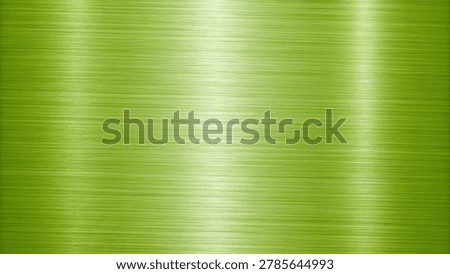 Smooth gradient texture of green metallic fabric under soft lighting