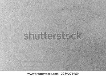 Smooth gray textured surface with subtle variations and a neutral appearance for backgrounds