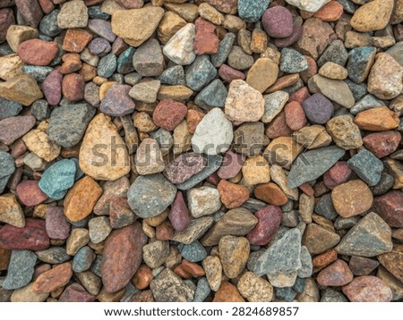 Smooth Multicolored River Rocks and Pebbles Stones Texture Background