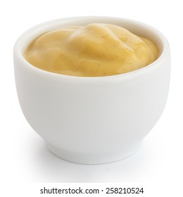 Smooth Mustard In White Ceramic Ramekin. White Background.