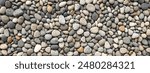 smooth pebbles background. variety of smooth, natural rocks with different shapes and textures