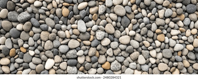 smooth pebbles background. variety of smooth, natural rocks with different shapes and textures - Powered by Shutterstock