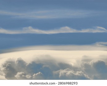 Smooth Pileus Cloud Cap Forming Above a Cumulus Tower